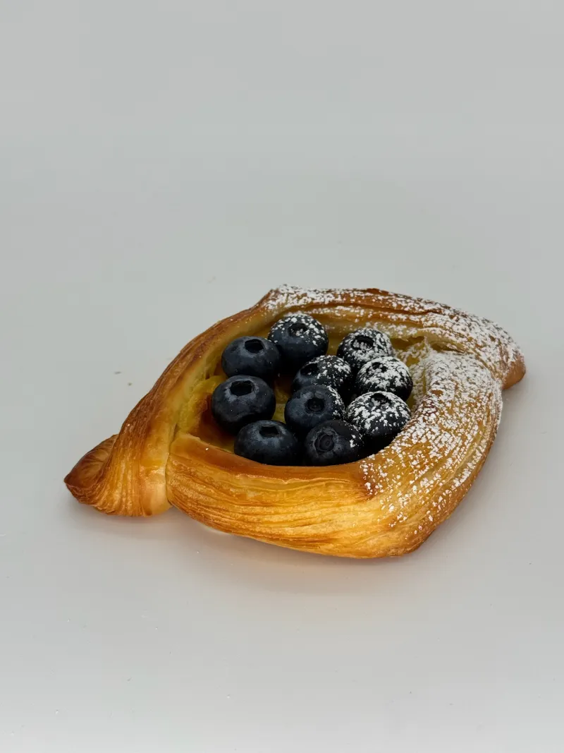 Baked Custard and fresh Blueberry Danish - Silky vanilla custard meets juicy blueberries inside golden, flaky layers. Sweet, creamy, and bursting with bright berry flavor.