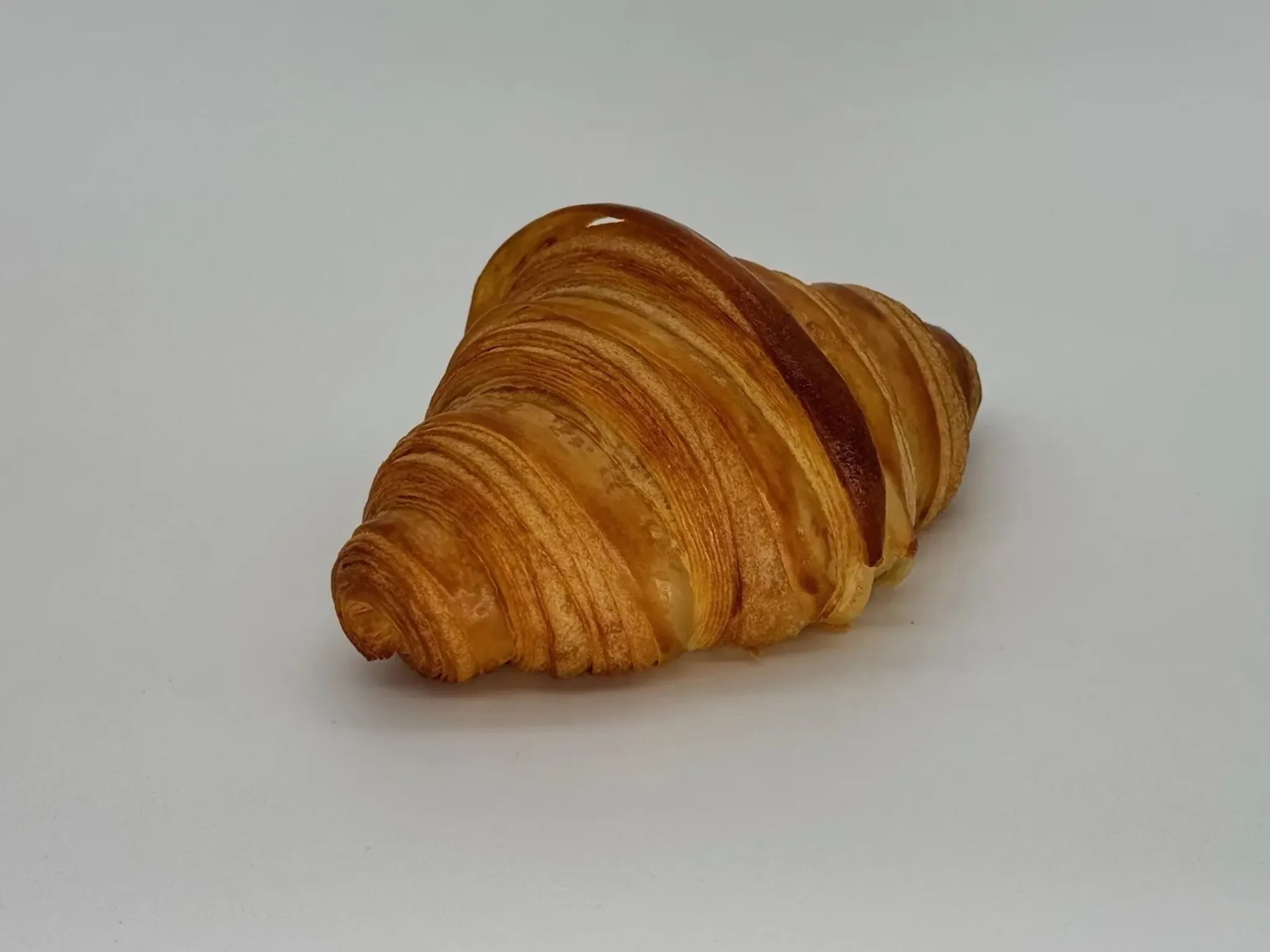 Butter Croissant - Break into golden, crackling layers and let warm butter melt on your tongue.