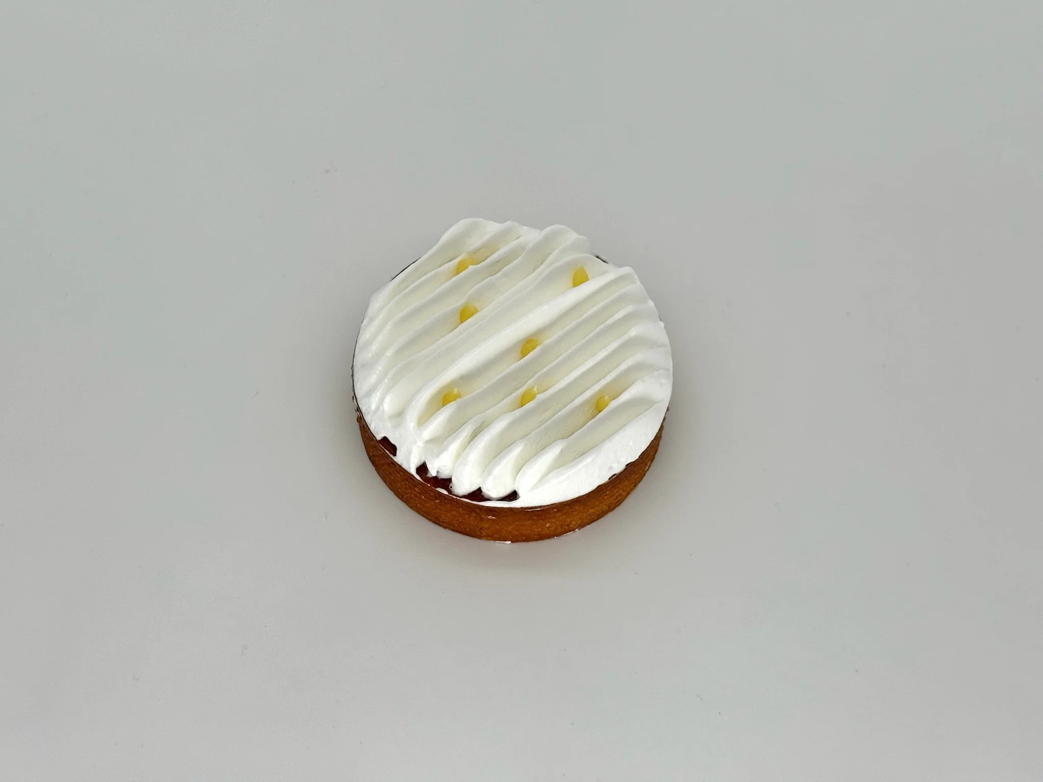 Classic Lemon Meringue Tartlet - Bright lemon curd in a crisp shell, finished with light and airy Italian meringue.